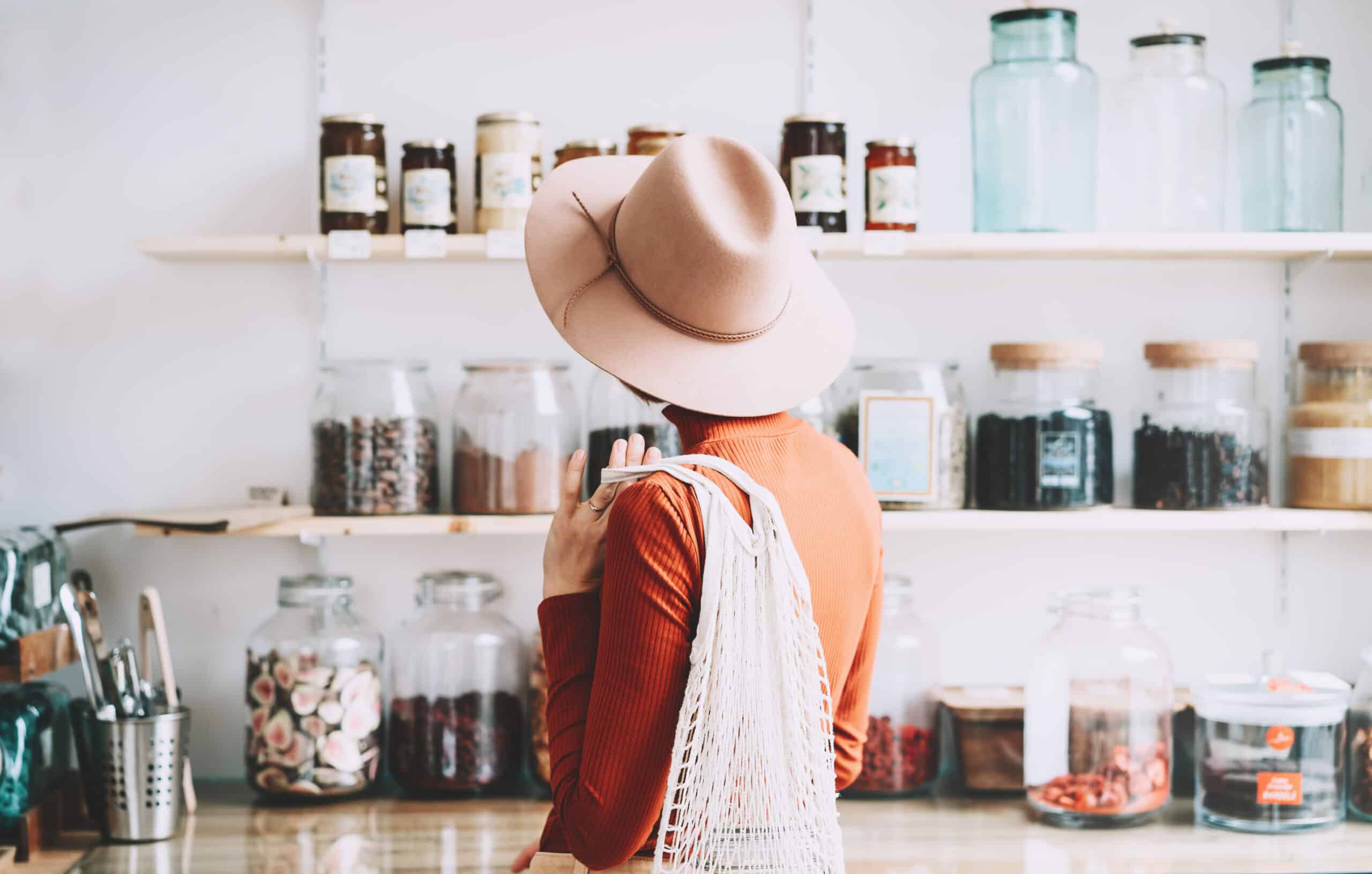 woman standing in front of groceries